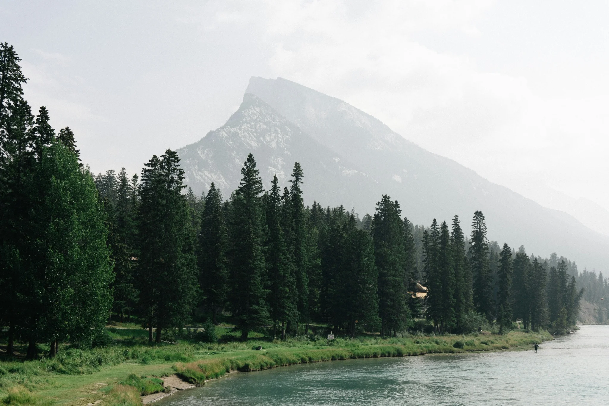 Silhouette of a person standing alone at dusk